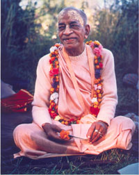 Prabhupada smiling with flower